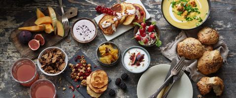 Various breakfast dishes on table