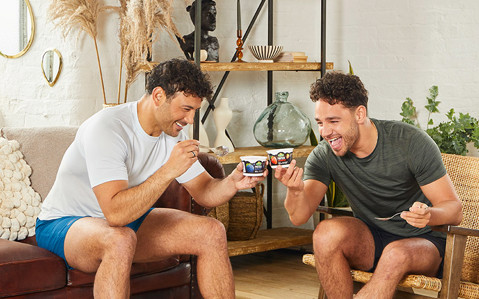 Adam and Ryan Thomas eating Arla Protein Yogurt at home