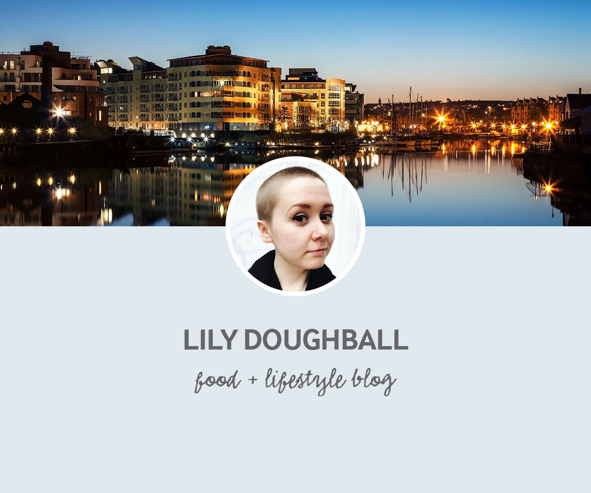Portrait of Lily Doughball with a backdrop of the waterfront in Bristol